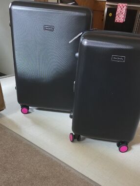 Vera Bradley Black Spinner Luggage with Pink Nail Accent